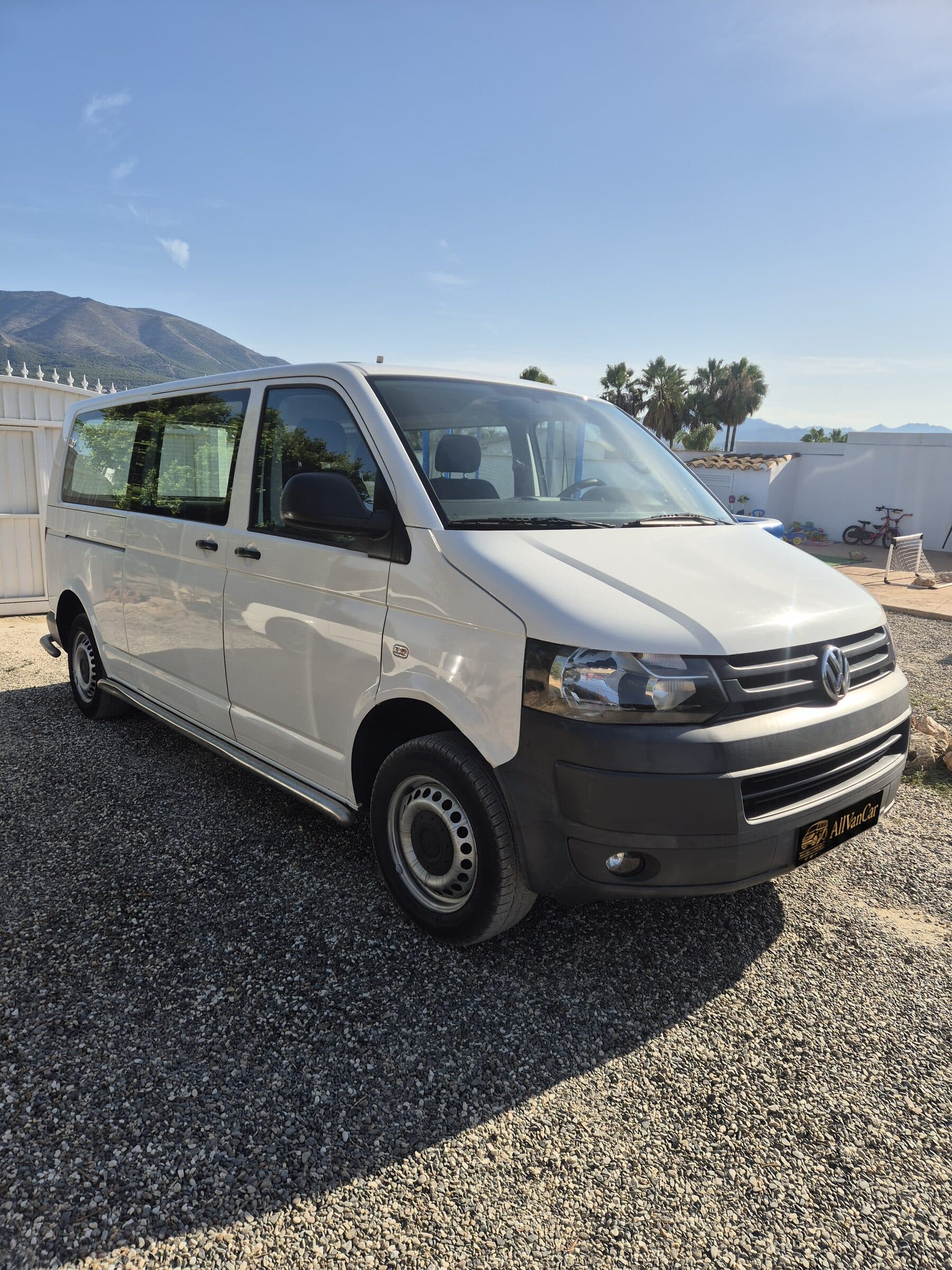 White Volkswagen Transporter with grey bumpers and visible steel wheels before preparation.